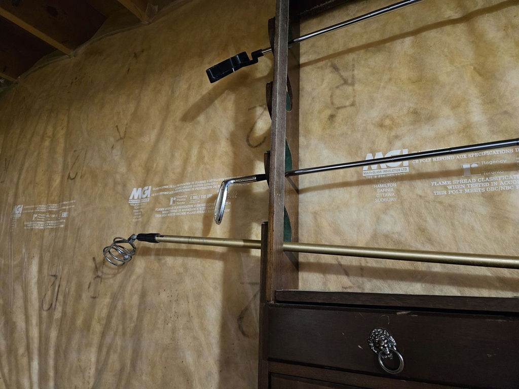 Dark wooden rack with rod display and golf ball bucket - image 3 of 8