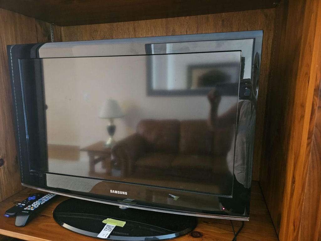 31" Samsung TV with Roku streaming device and remotes - image 2 of 7
