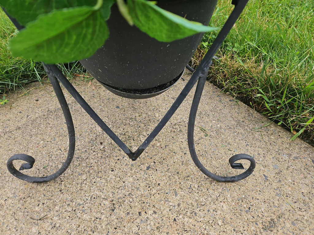 Heart-shaped wrought iron plant stand with a potted faux green plant and a Welcome sign - image 2 of 3