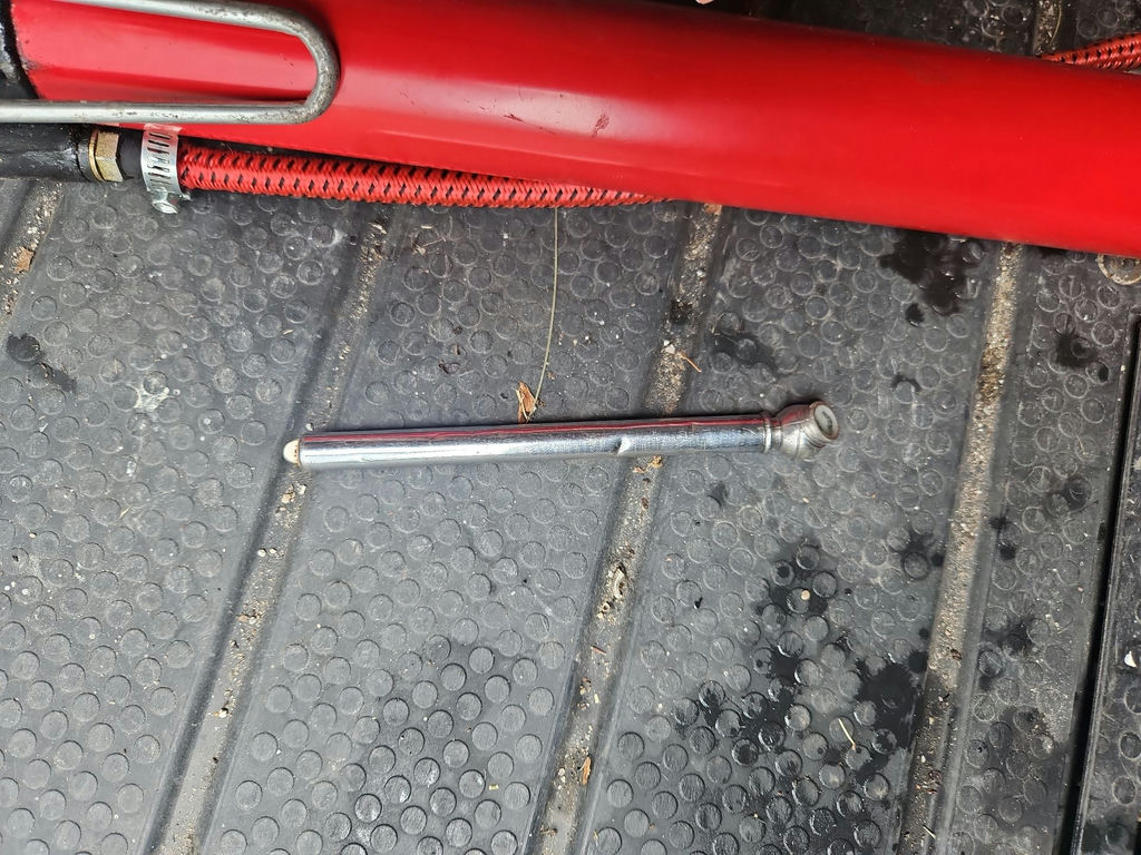 Red handheld manual air pump with hose - image 7 of 8