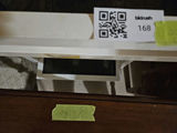Assorted furniture pieces: white glass-top display tables, a console table, and a wooden dresser - thumbnail 8 of 16