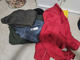 Pile of assorted jackets and coats - thumbnail 1 of 8
