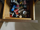 Sewing machine in Mid Century Modernwooden cabinet with sewing supplies - thumbnail 7 of 11