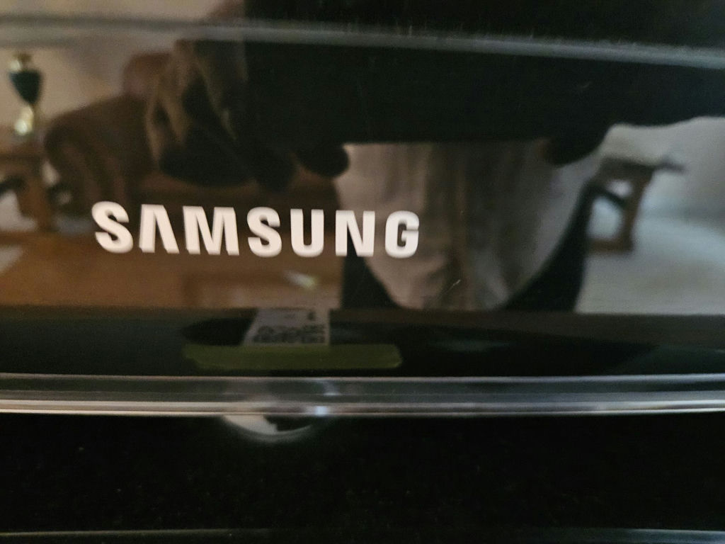 31" Samsung TV with Roku streaming device and remotes - image 3 of 7