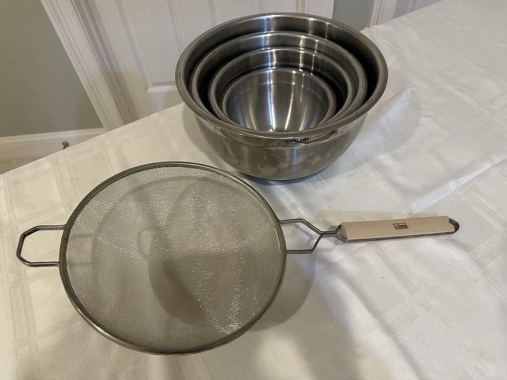 Stainless steel nesting bowls and a metal mesh strainer - image 1 of 5
