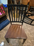Set of three black slat-back wooden dining chairs with brown seats and a wooden table - thumbnail 1 of 5