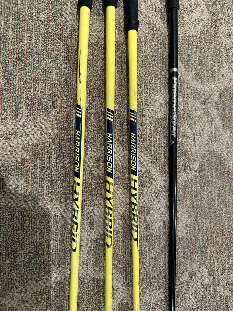 Golf clubs with yellow shafts and a black driver - image 2 of 6