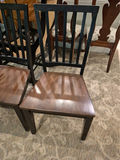 Set of three black slat-back wooden dining chairs with brown seats and a wooden table - thumbnail 4 of 5