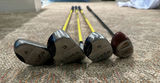 Golf clubs with yellow shafts and a black driver - thumbnail 5 of 6