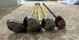 Golf clubs with yellow shafts and a black driver - thumbnail 6 of 6