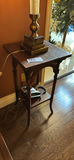 Ornate glass hurricane lamp on wooden side table - thumbnail 2 of 3