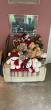 Beige striped sofa with stuffed teddy bears and framed wall art - thumbnail 2 of 7