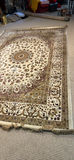 Large ornate oriental area rug with rolled rugs - thumbnail 3 of 5