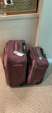 Two maroon rolling suitcases - thumbnail 1 of 4