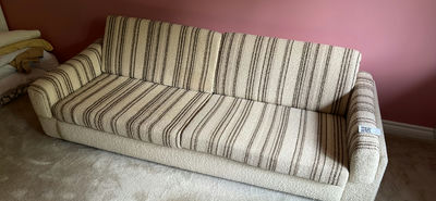 Beige striped sofa with stuffed teddy bears and framed wall art - Image 1 of 7