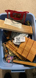 Assorted board games and game pieces in a blue tote - thumbnail 2 of 4