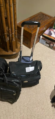 Assorted black rolling luggage bags - Image 1 of 7