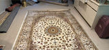 Large ornate oriental area rug with rolled rugs - thumbnail 1 of 5