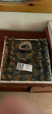 Stone chess set on checkered board with geode centerpiece - Image 1 of 4