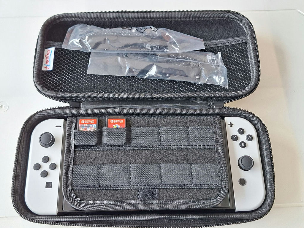Nintendo Switch Console with Carrying Case and Game Cartridges - image 1 of 5
