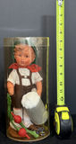 Vintage Baby Doll with Garden Accessories in Clear Cylinder - thumbnail 1 of 3