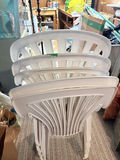 Stack of White Plastic Patio Chairs - thumbnail 2 of 3