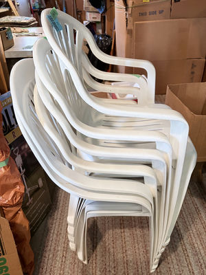 Stack of White Plastic Patio Chairs - Image 1 of 3