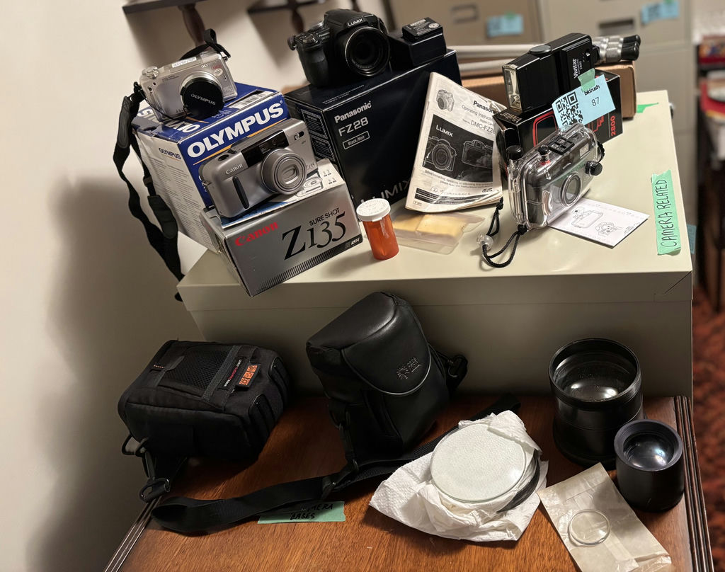 Assorted Cameras, Camera Accessories, and Lens Cases - image 1 of 30