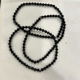 Black bead jewelry set (fringe necklace, geometric bead necklace, bracelet, and drop earrings) - thumbnail 2 of 4
