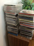Stacks of CD jewel cases and music - thumbnail 1 of 4