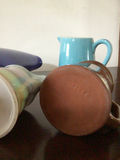 Assorted ceramic teaware: pitcher, mugs and creamers - thumbnail 4 of 5