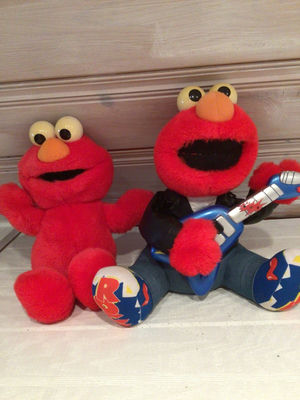Sesame Street Elmo plush toys with guitar - Image 1 of 1