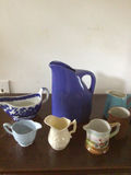 Assorted ceramic teaware: pitcher, mugs and creamers - thumbnail 1 of 5