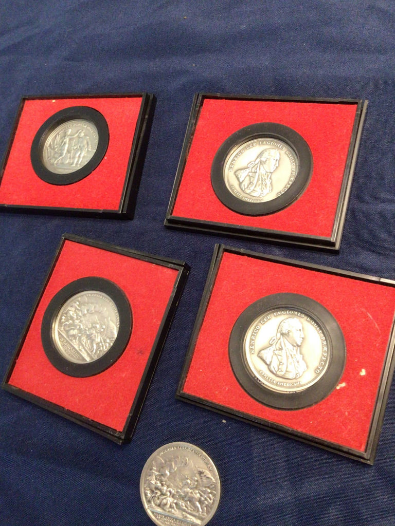 Silver medals in red presentation frames with America’s First Medals album - image 1 of 3