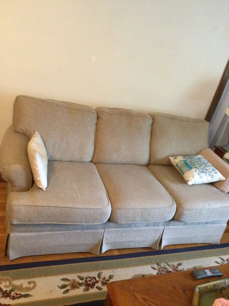 Light gray fabric sofa with two decorative pillows - image 2 of 2