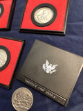 Silver medals in red presentation frames with America’s First Medals album - thumbnail 3 of 3