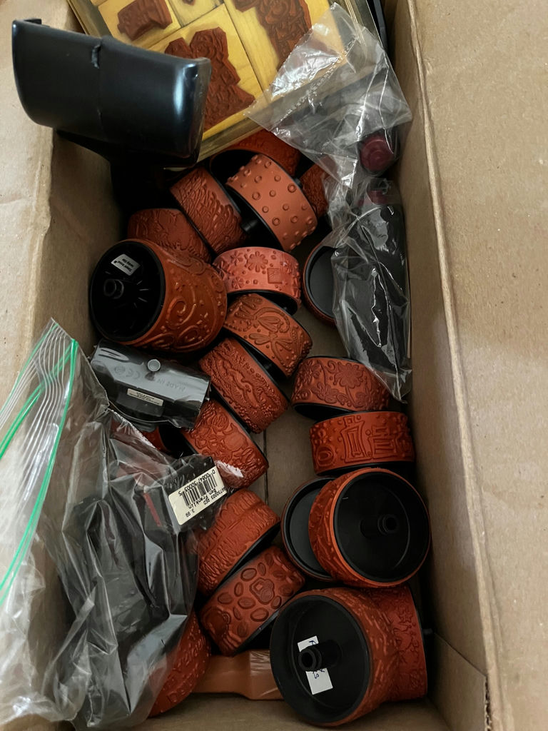 Assorted craft supplies: rubber stamps, embossed leather bracelets, and plastic fruit shapes - image 1 of 3