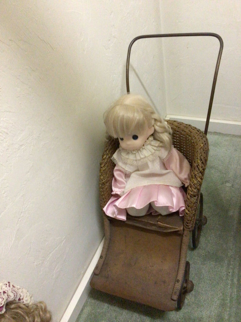 Blonde doll in pink dress and a wicker doll carriage with a second doll - image 1 of 4