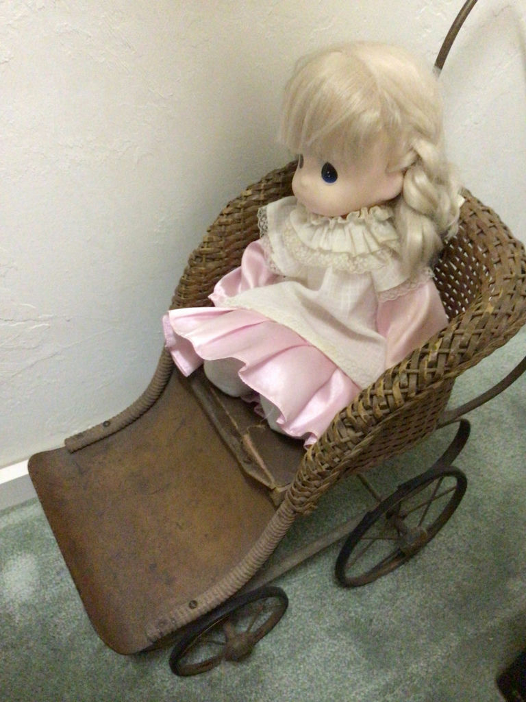 Blonde doll in pink dress and a wicker doll carriage with a second doll - image 3 of 4