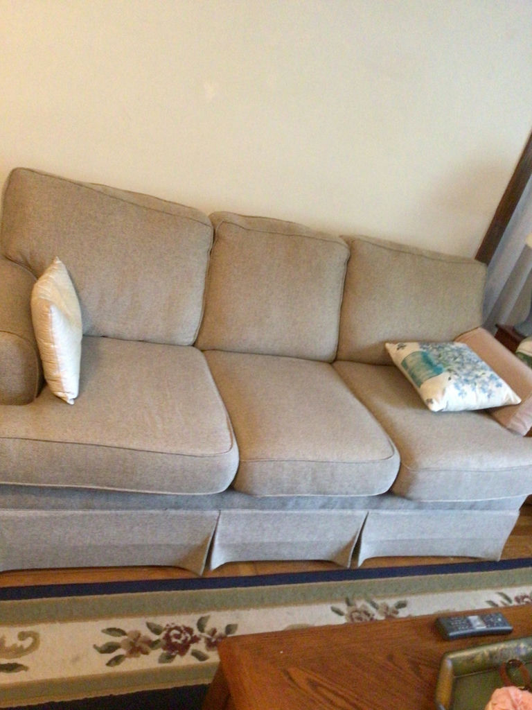 Light gray fabric sofa with two decorative pillows - image 1 of 2