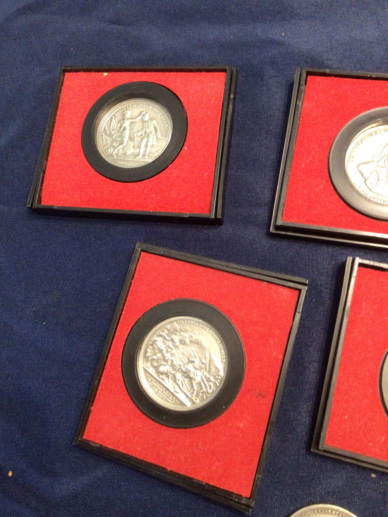 Silver medals in red presentation frames with America’s First Medals album - image 2 of 3