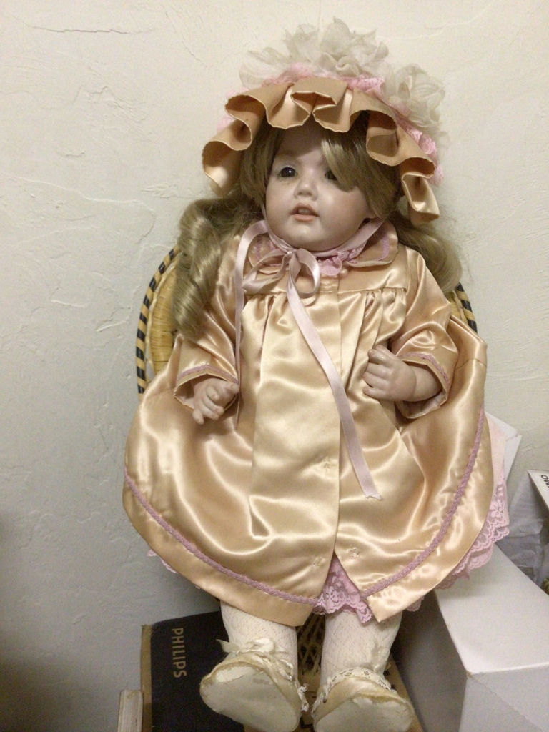 Doll in peach satin dress with bonnet - image 1 of 1