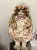 Doll in peach satin dress with bonnet - thumbnail 1 of 1