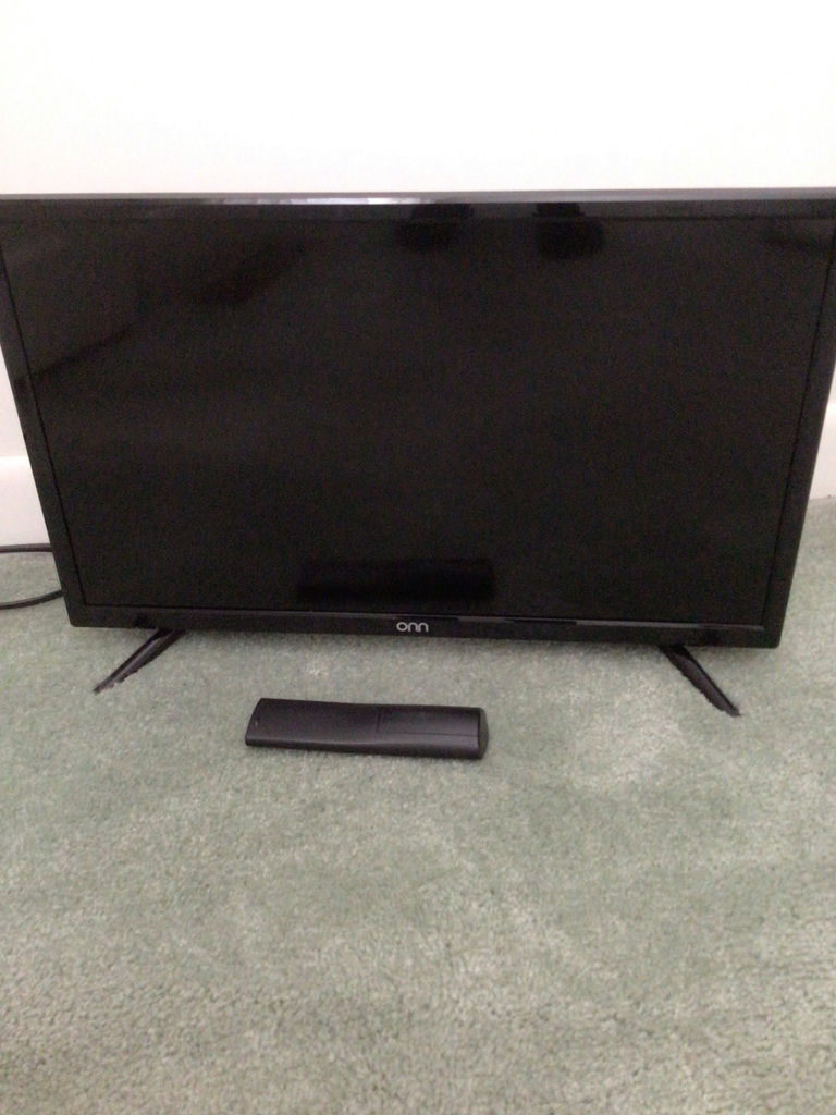 Flat-screen television with remote - image 1 of 1