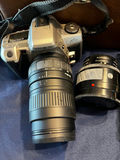 Minolta 35mm SLR camera with zoom lens and accessories in a leather case - thumbnail 2 of 3