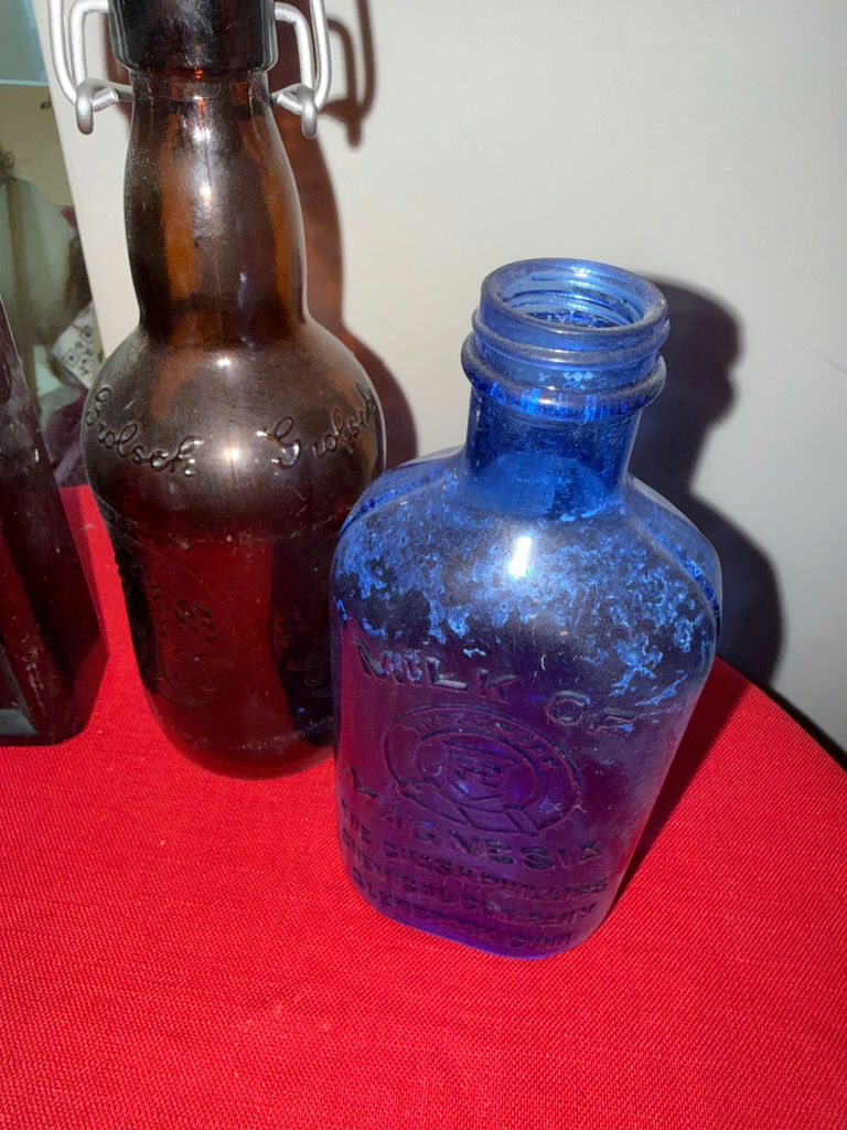Collection of vintage glass bottles and blue etched glass ornament - image 3 of 3
