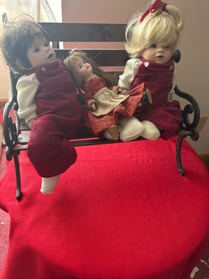 Three cloth dolls on a bench - Image 1 of 6
