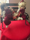 Three cloth dolls on a bench - thumbnail 1 of 6