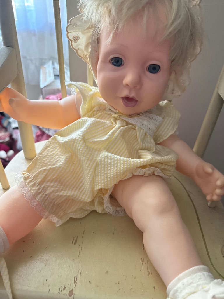 Vintage baby doll on a wooden rocking chair - image 2 of 5
