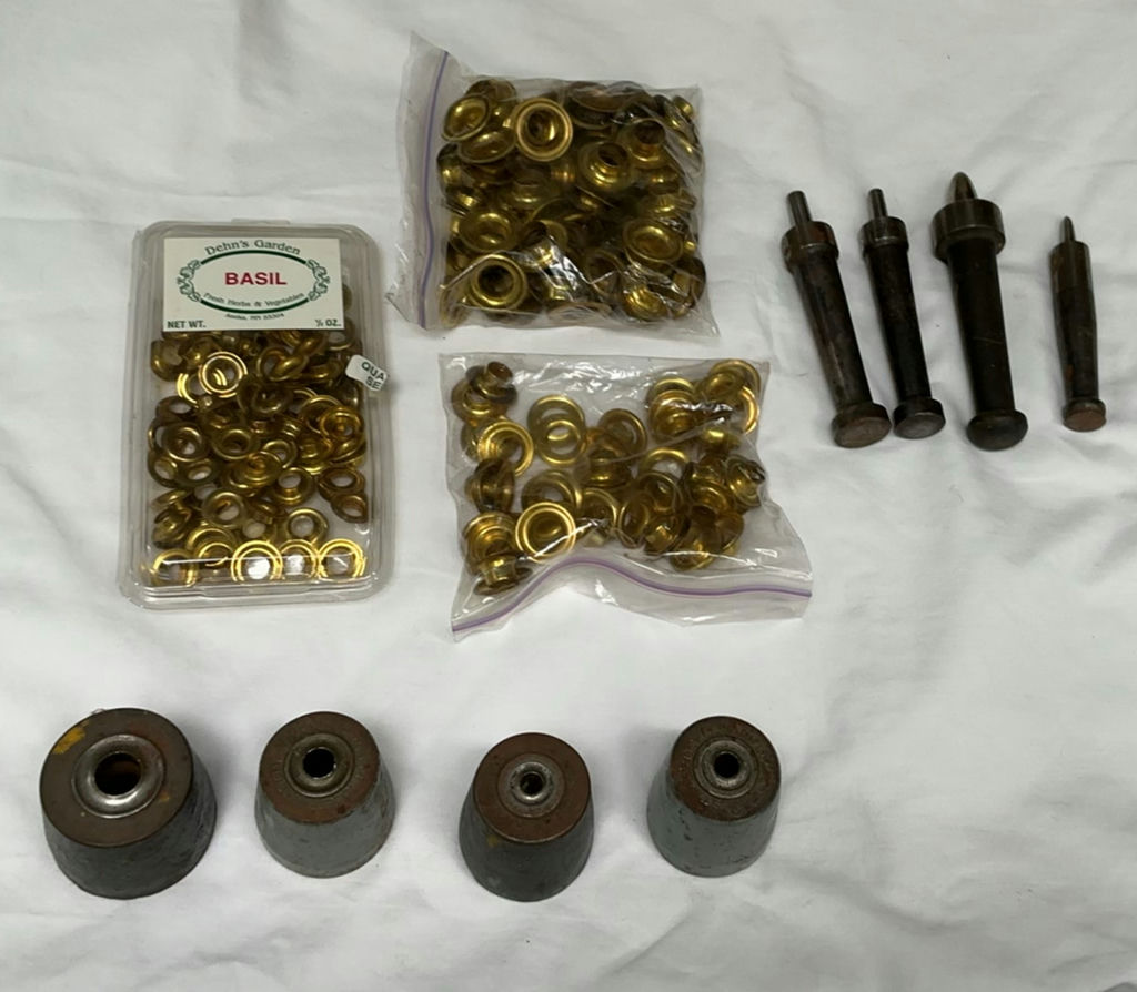 Assorted brass eyelets and metal tools - image 1 of 4
